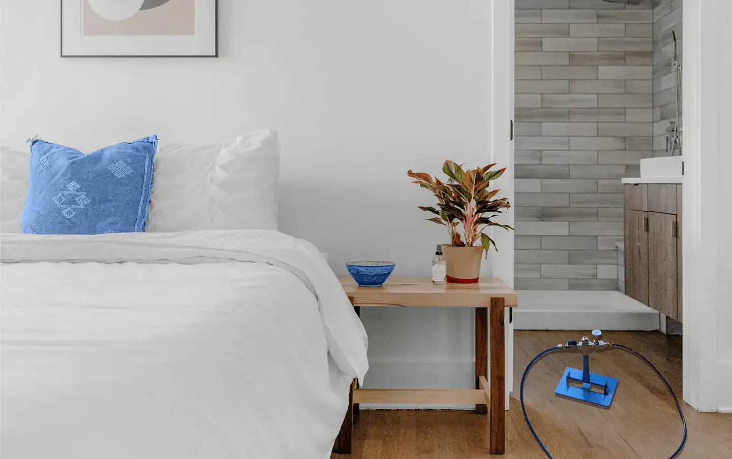A bedroom with a fog head on the floor during treatment