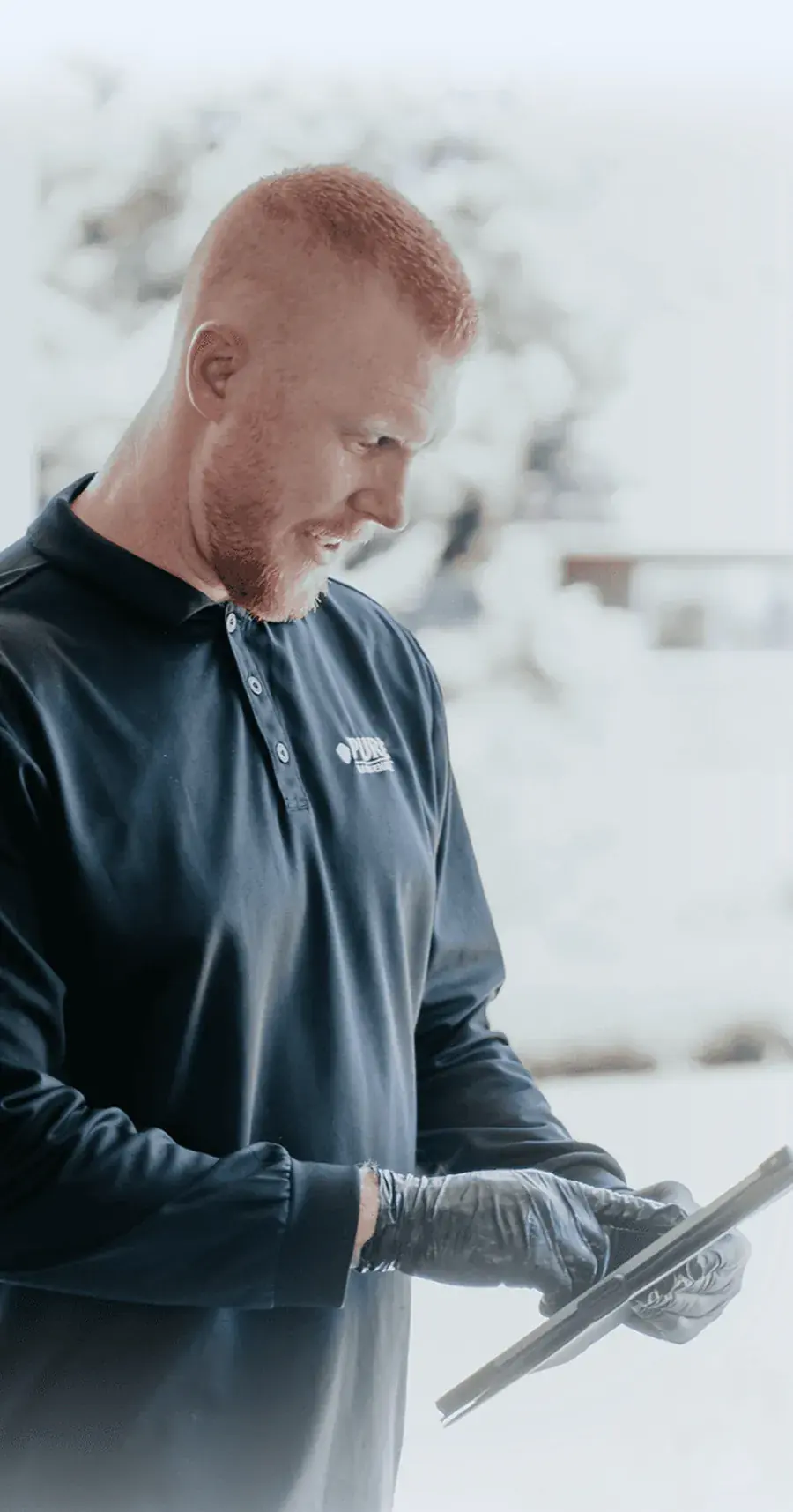 A technician reviewing notes on a tablet